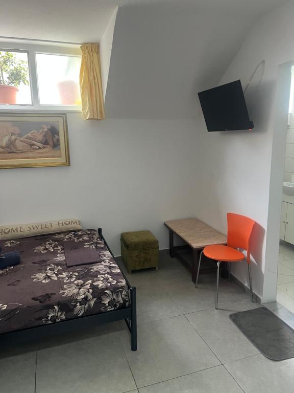 A television and/or entertainment centre at Centrally Located Private Rooms