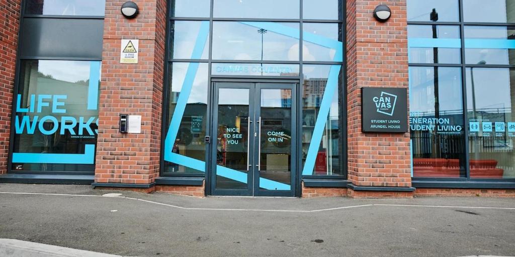 a store front with an open door with the words life work at Canvas Arundel House in Coventry in Coventry