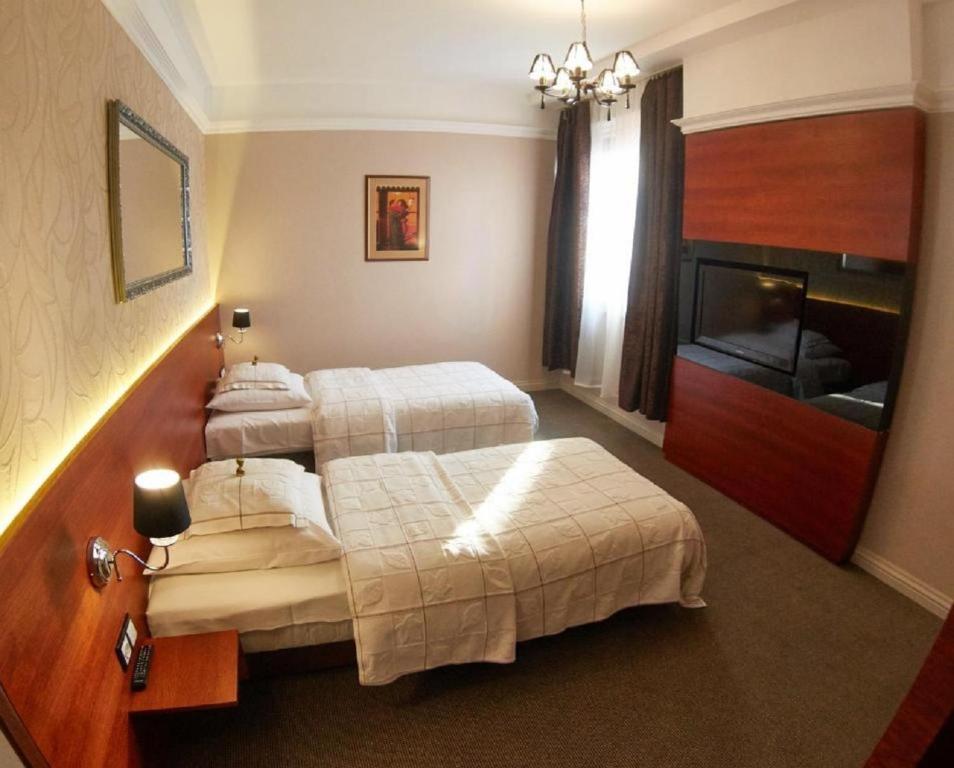 Postel nebo postele na pokoji v ubytování Hotel&Spa Kameleon