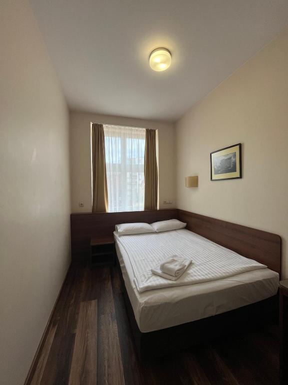 Postel nebo postele na pokoji v ubytování Memel Hotel