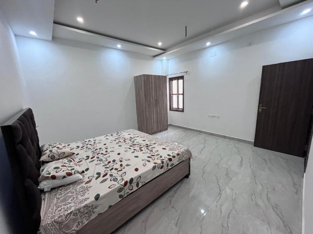 Postel nebo postele na pokoji v ubytování Hridayam Kashi Homestay