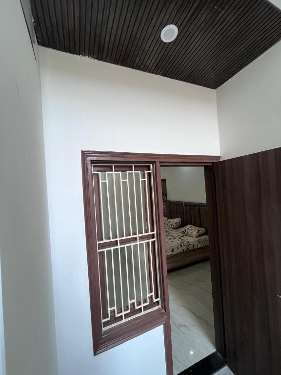 Postel nebo postele na pokoji v ubytování Hridayam Kashi Homestay