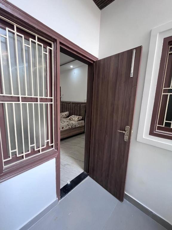 Postel nebo postele na pokoji v ubytování Hridayam Kashi Homestay