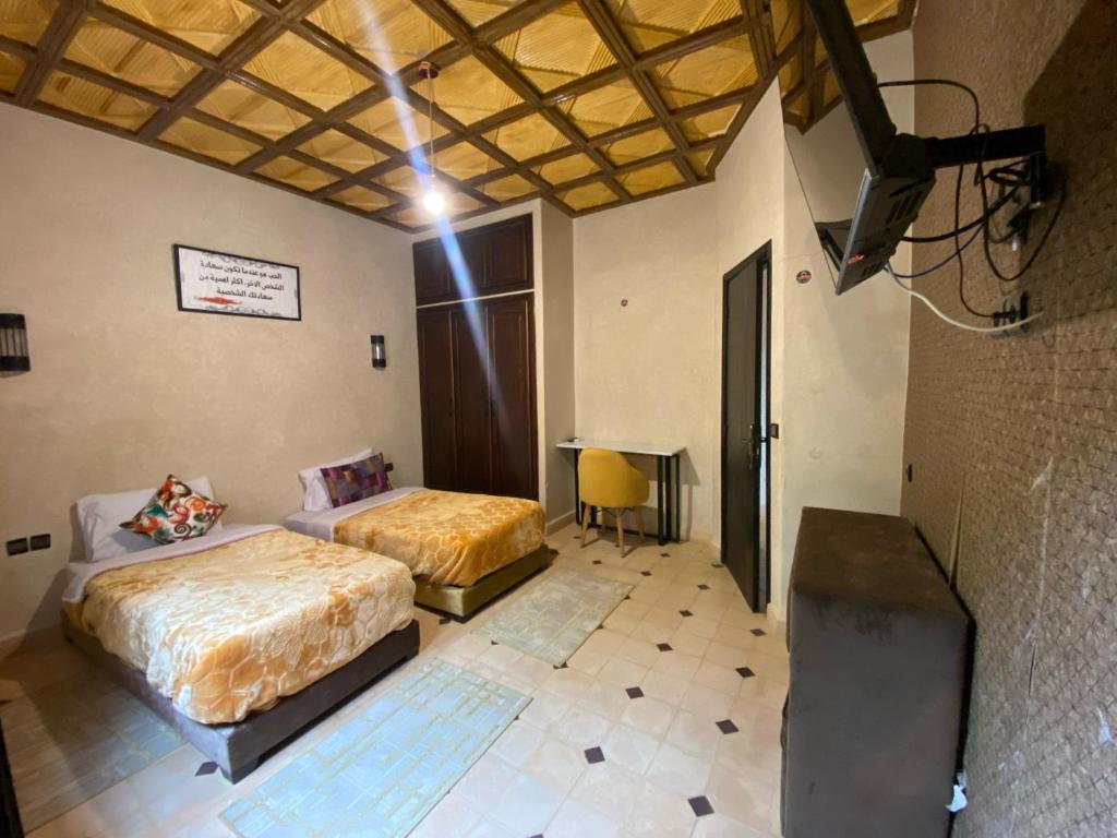 Postel nebo postele na pokoji v ubytování Hotel Jnane riad