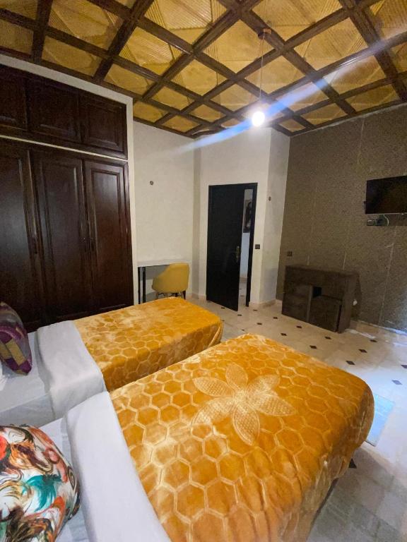 Postel nebo postele na pokoji v ubytování Hotel Jnane riad