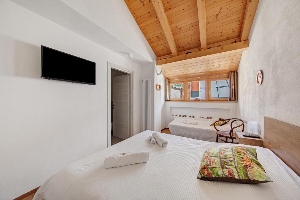 Ένα ή περισσότερα κρεβάτια σε δωμάτιο στο Le Nene - Dolomiti guesthouse