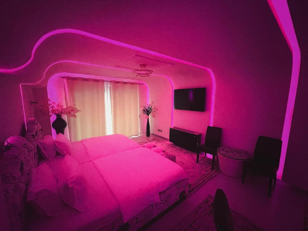 Llit o llits en una habitació de Hotel Rosa Blu