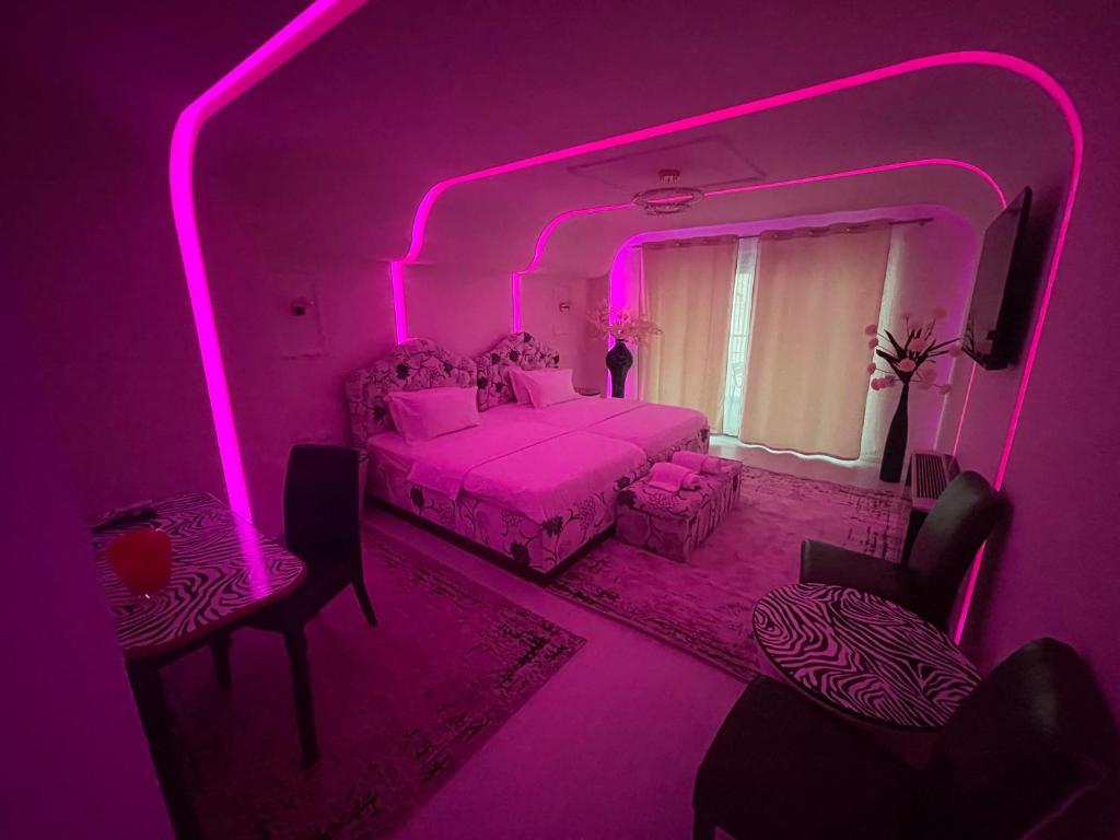 Llit o llits en una habitació de Hotel Rosa Blu