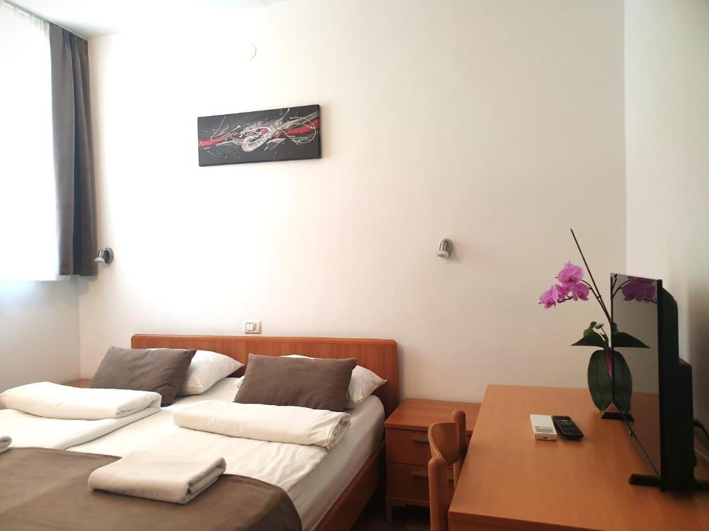 Postel nebo postele na pokoji v ubytování Garni Hotel Keltika