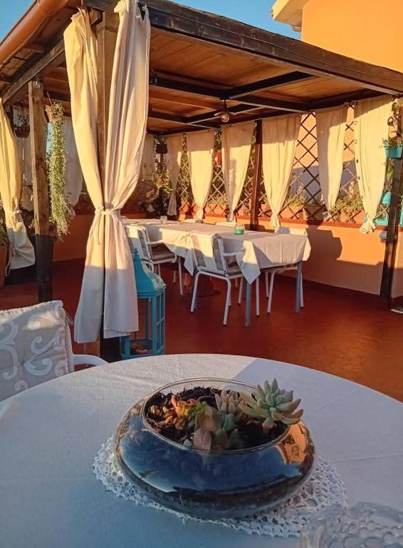 a table with a bowl of food on top of it at Belli come il Sole in Serri