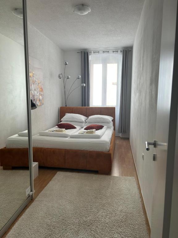 Posteľ alebo postele v izbe v ubytovaní Apartman Evita