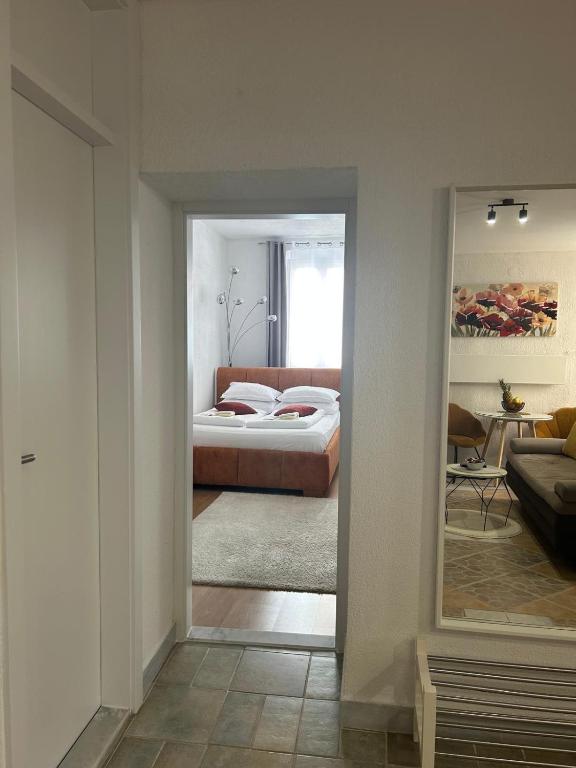 Posteľ alebo postele v izbe v ubytovaní Apartman Evita