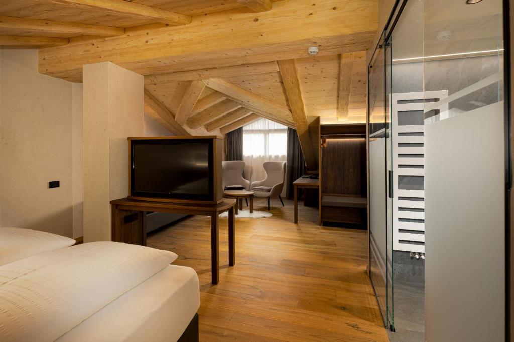 Voodi või voodid majutusasutuse Camino Rustic Chic Hotel toas