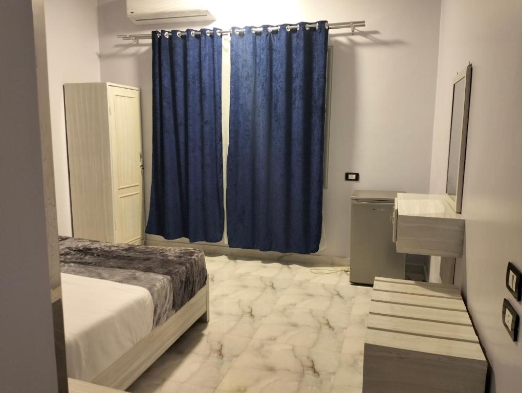 Postel nebo postele na pokoji v ubytování Rayan Nubian Guest House