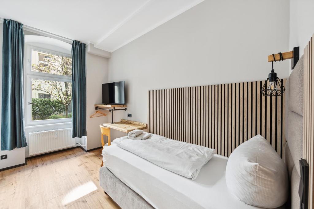 Postel nebo postele na pokoji v ubytování Hotel Comenius