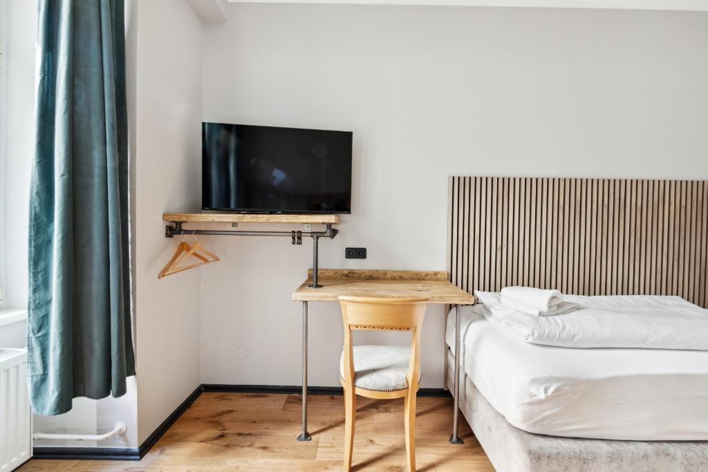 Postel nebo postele na pokoji v ubytování Hotel Comenius