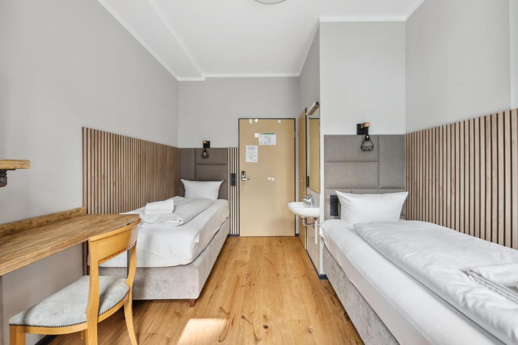 Postel nebo postele na pokoji v ubytování Hotel Comenius