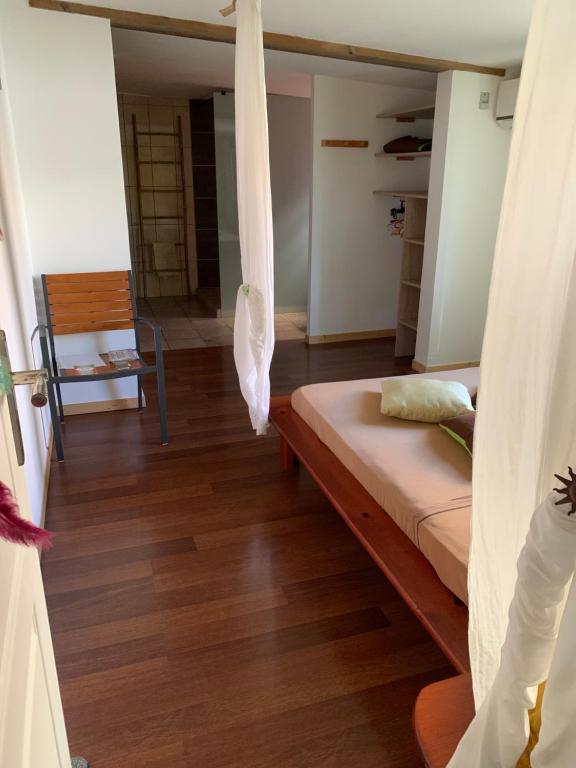 Postel nebo postele na pokoji v ubytování Suite parentale