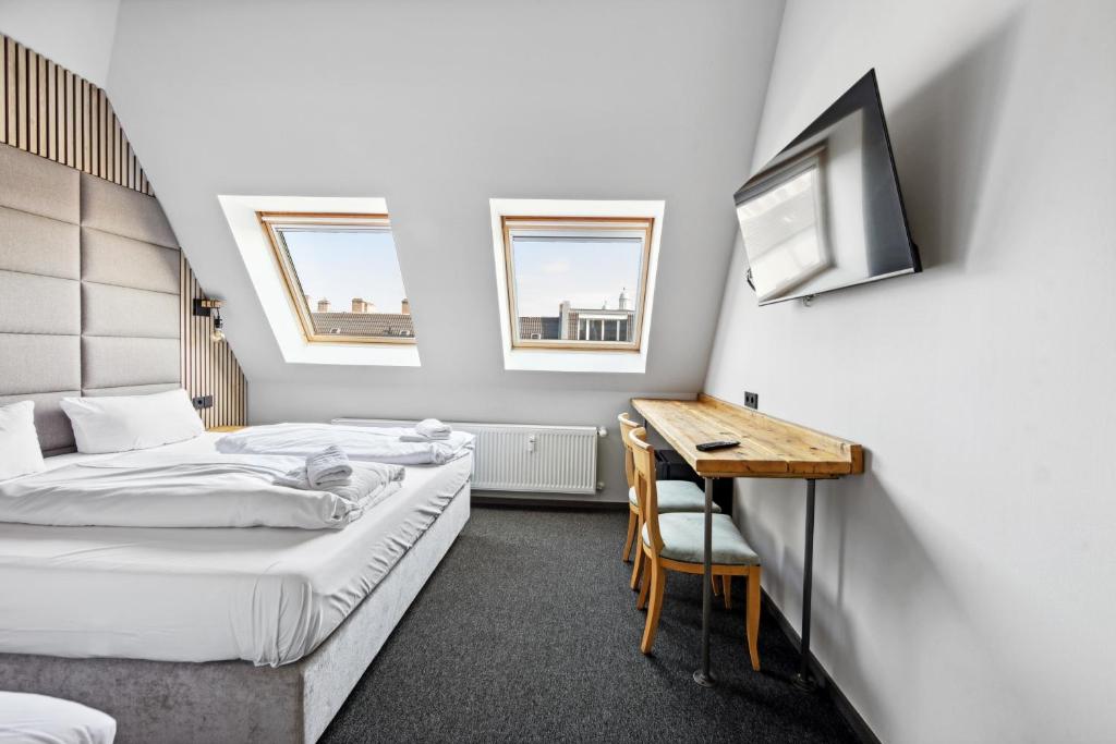 Postel nebo postele na pokoji v ubytování Hotel Comenius