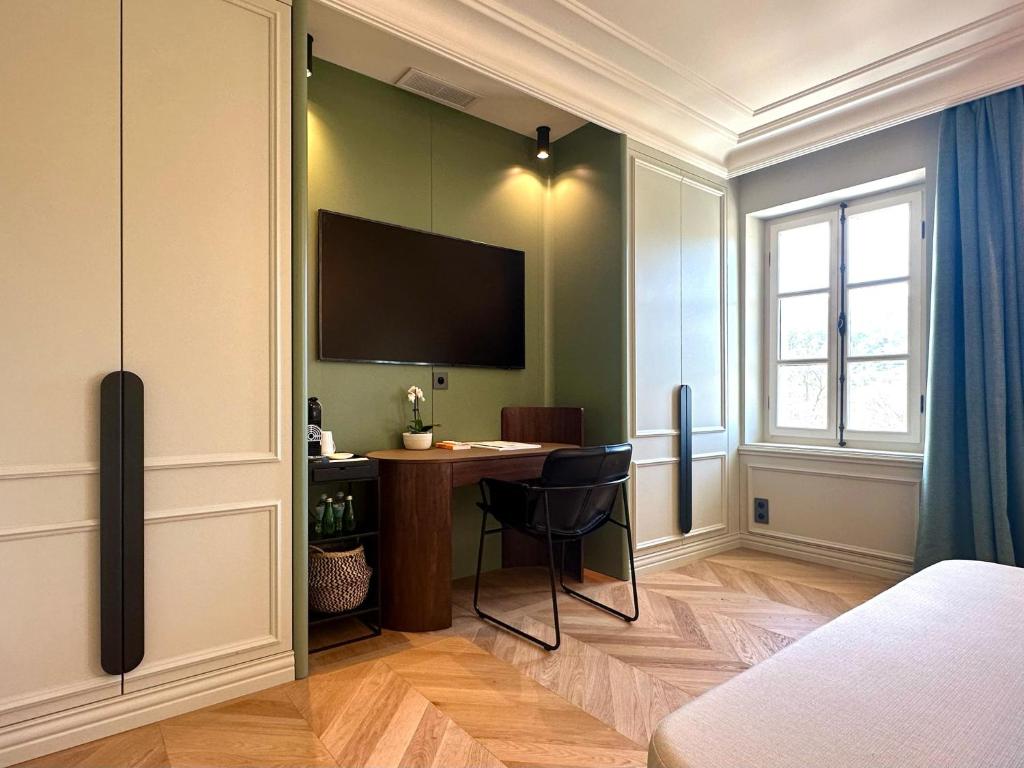 TV a/nebo společenská místnost v ubytování Chateau Pimo