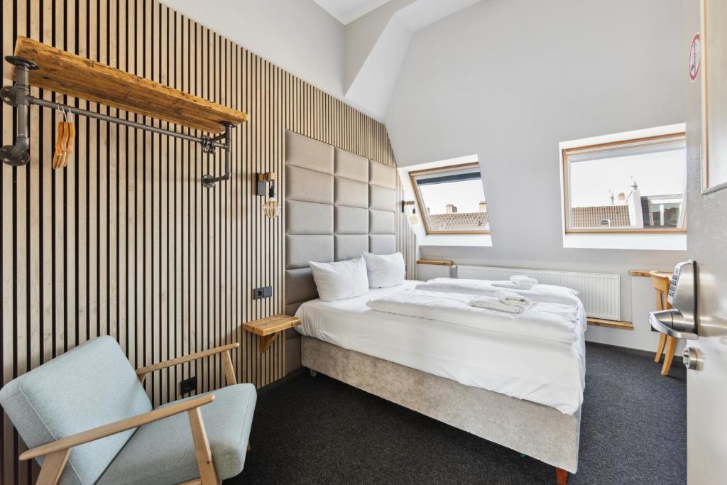 Postel nebo postele na pokoji v ubytování Hotel Comenius