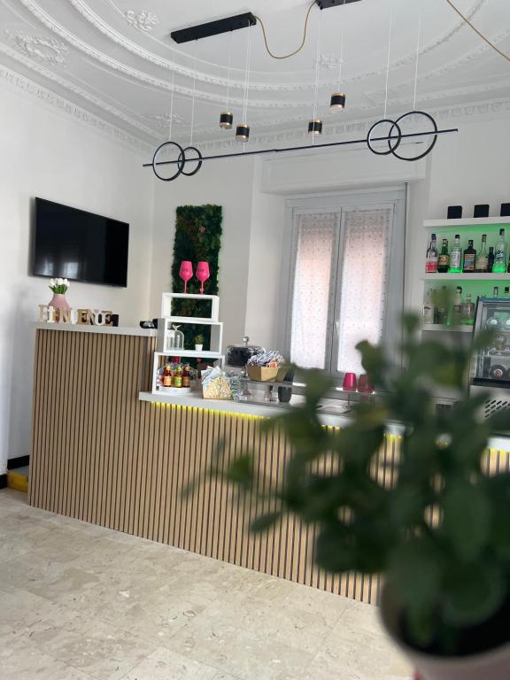 TV a/nebo společenská místnost v ubytování Hotel & Garden