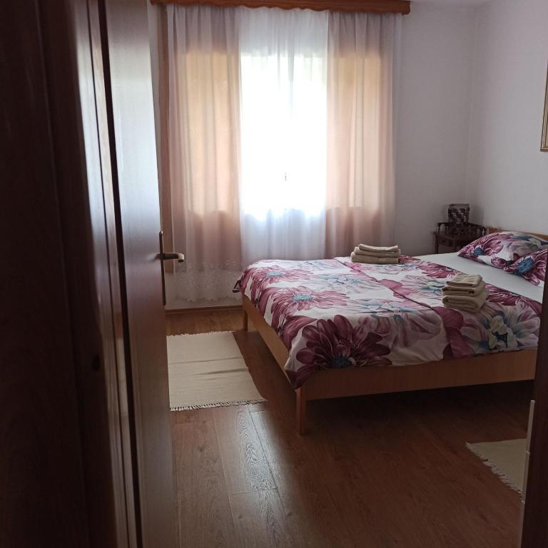 Postel nebo postele na pokoji v ubytování Apartman Adna