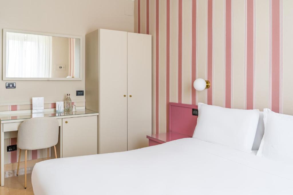 Postel nebo postele na pokoji v ubytování Hotel Parker - Gruppo BLAM HOTELS