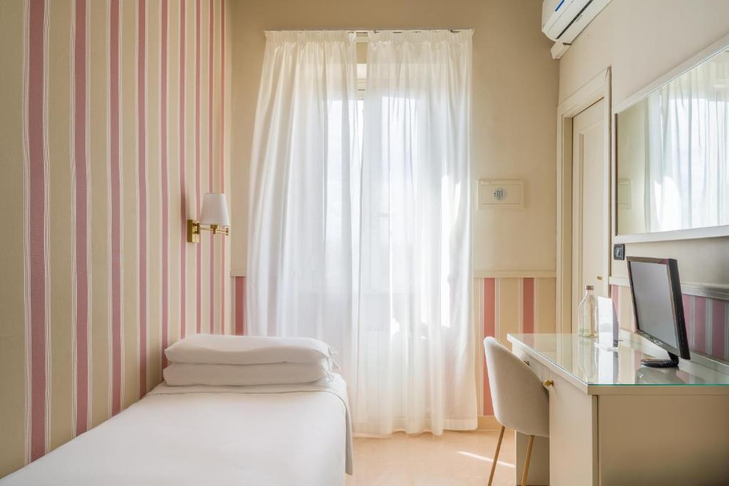 Postel nebo postele na pokoji v ubytování Hotel Parker - Gruppo BLAM HOTELS