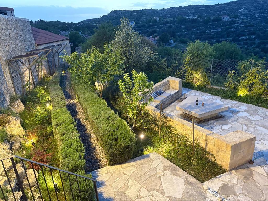 an overhead view of a garden with a bench at myLofou in Lofou
