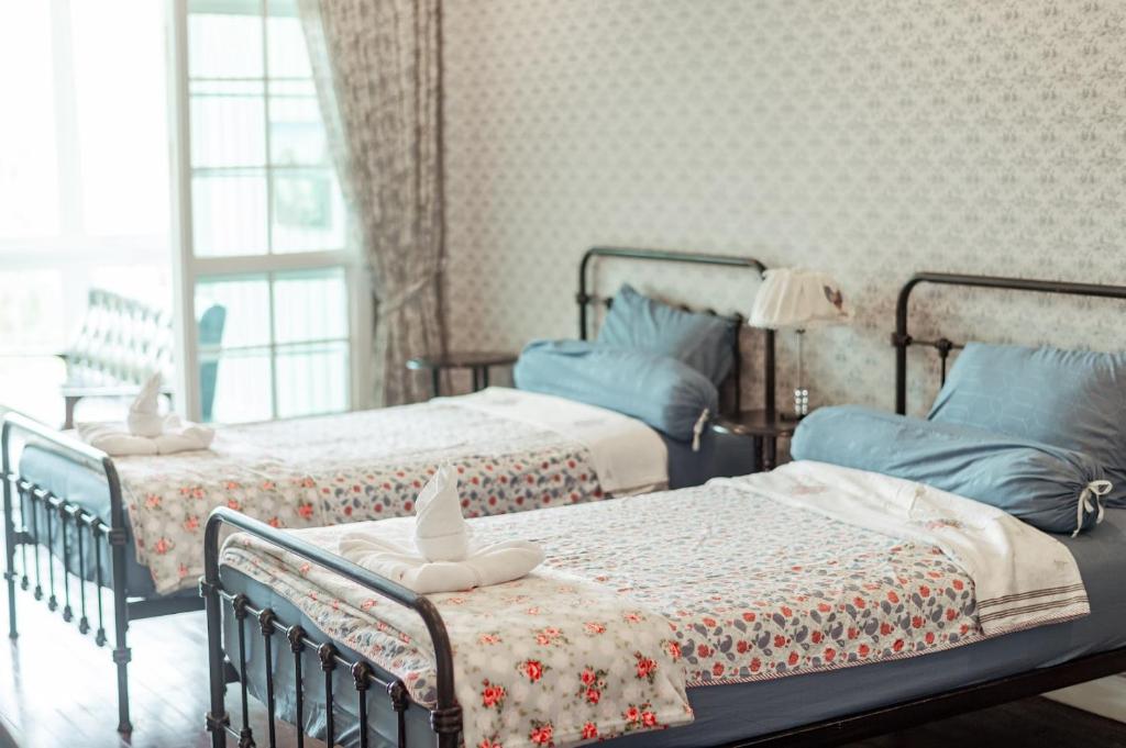 Letto o letti in una camera di Hacienda Home