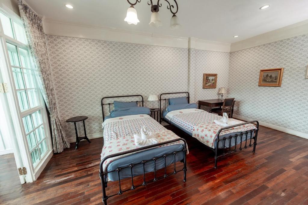 Letto o letti in una camera di Hacienda Home