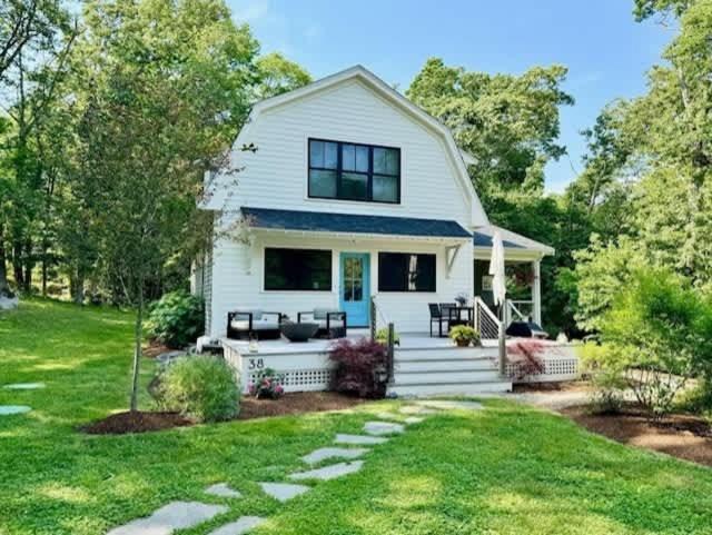 a white house with a porch and a lawn at Modern 3b3b Country House and Barn on quiet road in Little Compton