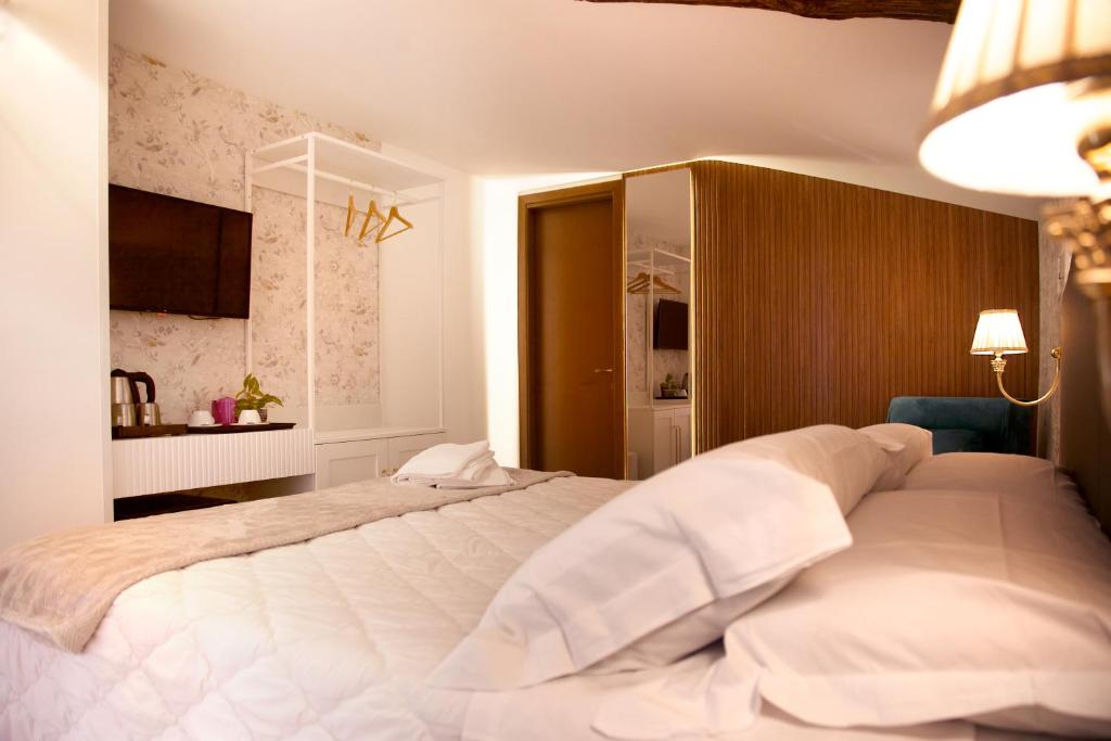 Postel nebo postele na pokoji v ubytování Hotel Silva