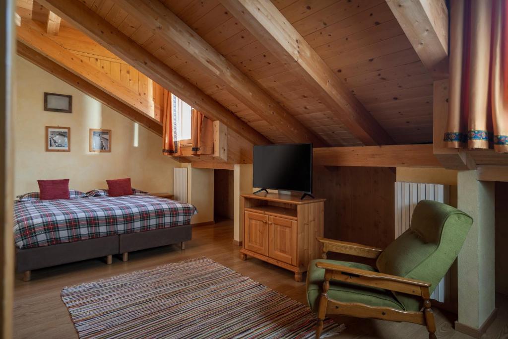 Voodi või voodid majutusasutuse Chalet Stelle Di Neve toas