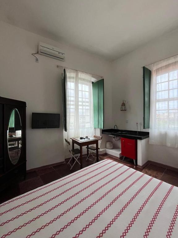 Postel nebo postele na pokoji v ubytování Apto com Arte no Pelourinho