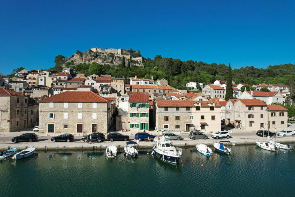a group of boats are docked in a harbor at Seafront Stone House Sajbel in Novigrad Dalmatia