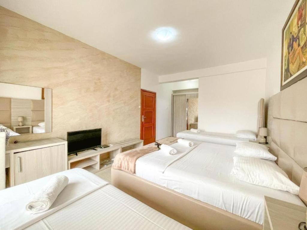 Postel nebo postele na pokoji v ubytování Imperial Hotel