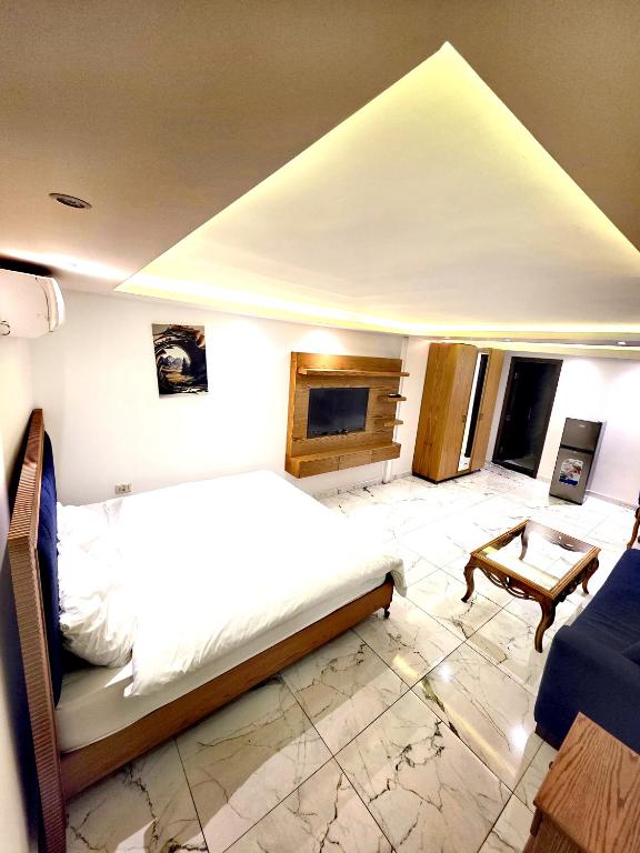 Postel nebo postele na pokoji v ubytování Sama Hamra Hotel