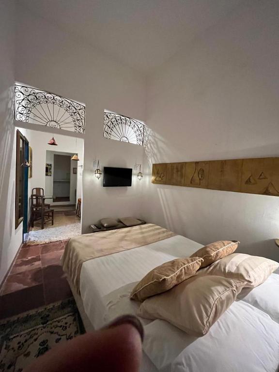 Postel nebo postele na pokoji v ubytování Apto com Arte no Pelourinho