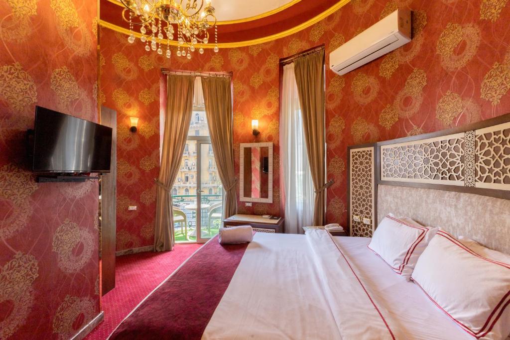 Postel nebo postele na pokoji v ubytování Cairo Inn