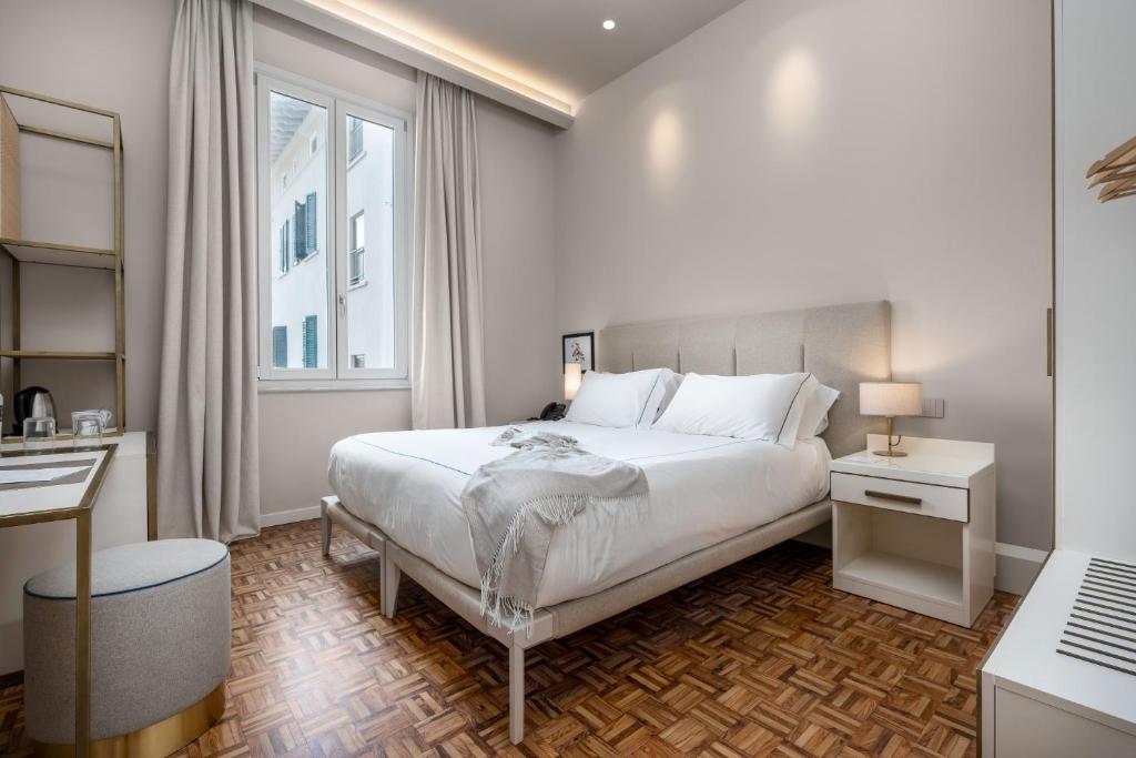 Postel nebo postele na pokoji v ubytování Palazzo BelVedere