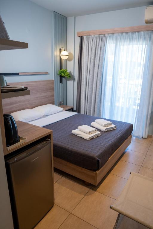 Postel nebo postele na pokoji v ubytování Hotel Epavlis Eleftheriadi