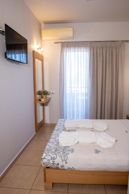 Postel nebo postele na pokoji v ubytování Hotel Epavlis Eleftheriadi