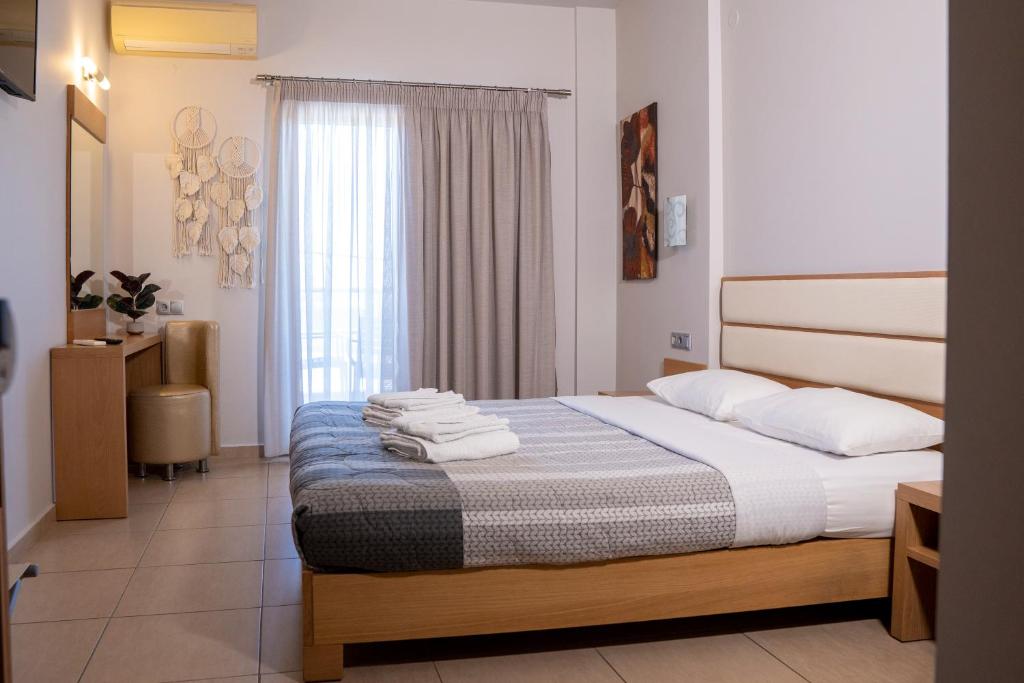 Postel nebo postele na pokoji v ubytování Hotel Epavlis Eleftheriadi
