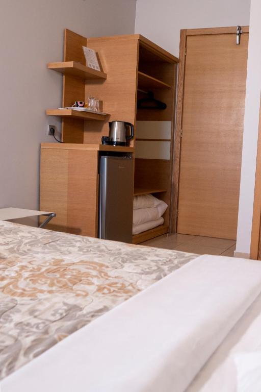 Postel nebo postele na pokoji v ubytování Hotel Epavlis Eleftheriadi