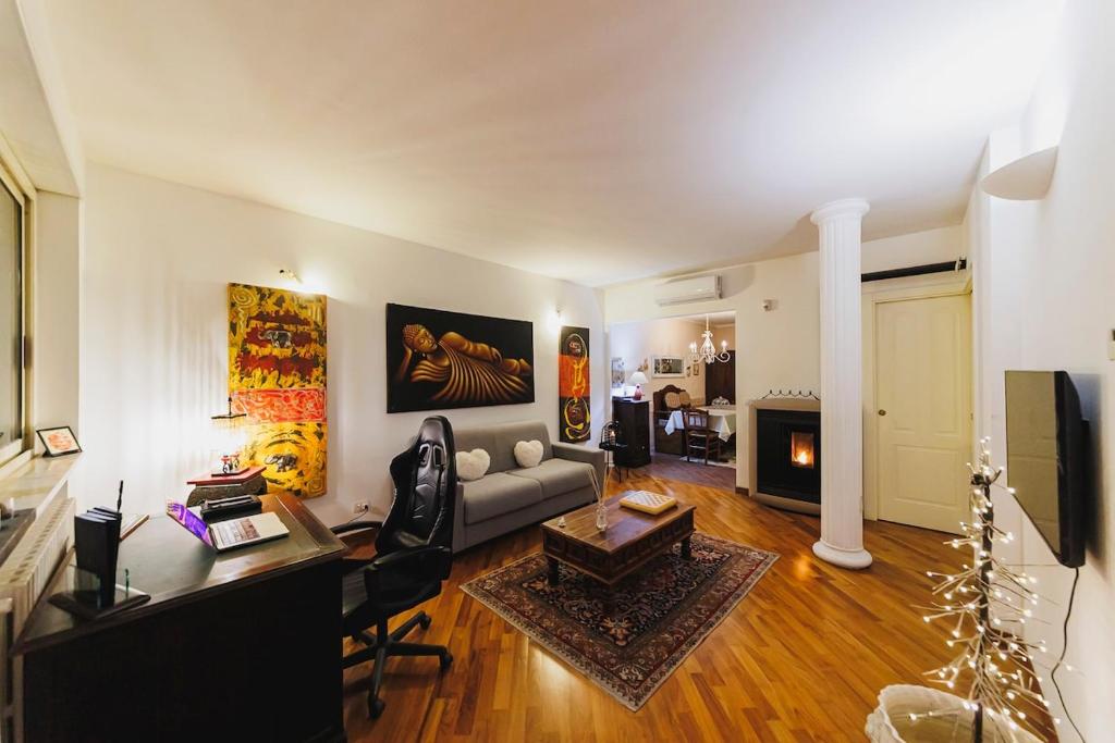 a living room with a couch and a table at Villa ElSi, Where Relaxation and Elegance Meet in Valenzano