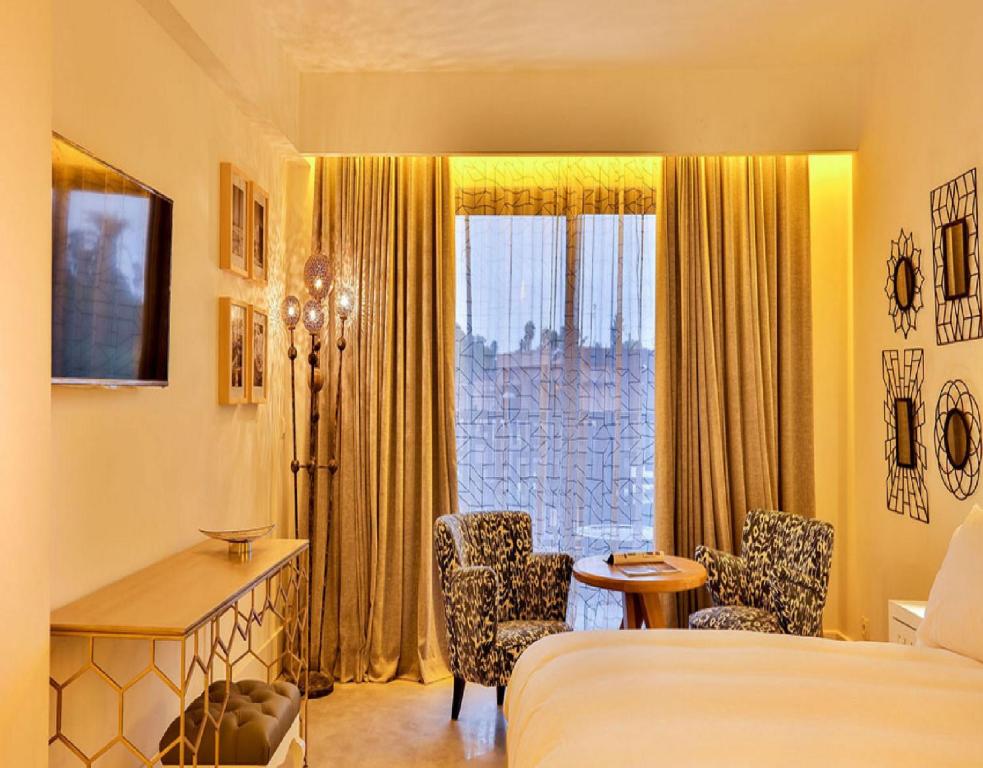 Postel nebo postele na pokoji v ubytování 2Ciels Boutique Hôtel