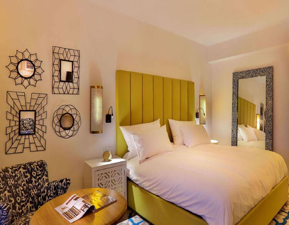 Postel nebo postele na pokoji v ubytování 2Ciels Boutique Hôtel