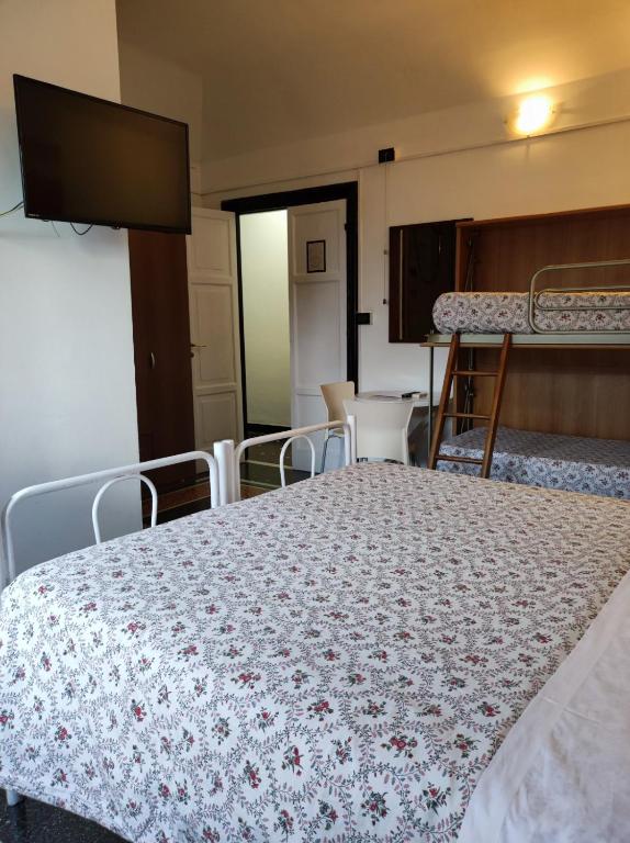 Postel nebo postele na pokoji v ubytování Hotel Caffaro